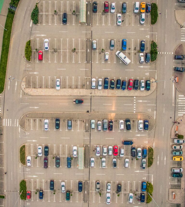 Aerial view of a private car park showing organised parking spaces and vehicle access routes.