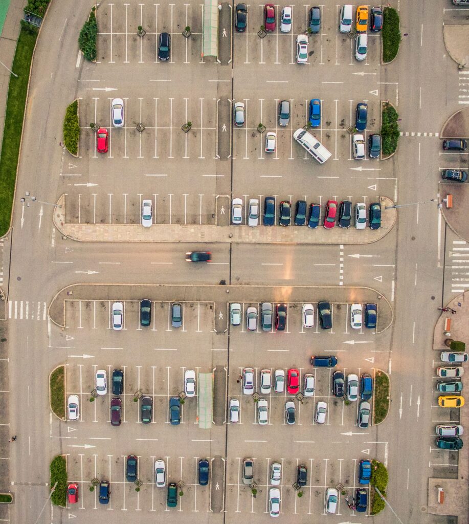 Aerial view of a private car park showing organised parking spaces and vehicle access routes.