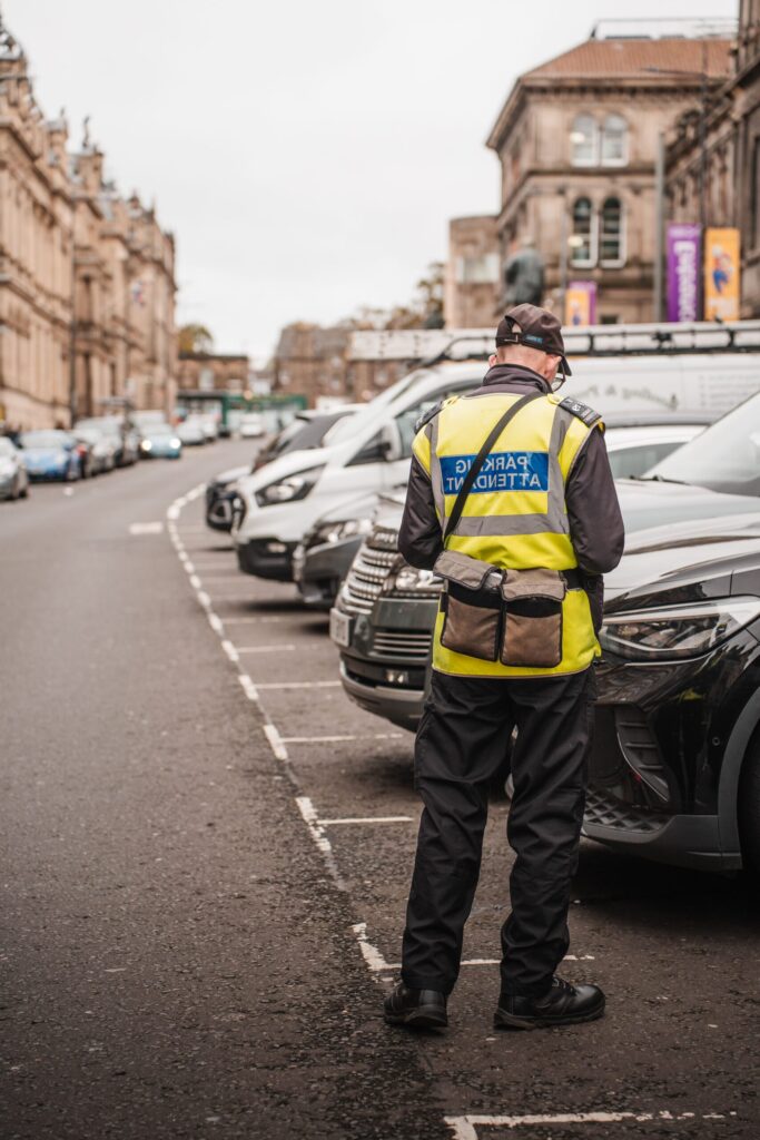 Parking attendant monitoring a private car park as part of Control Direct parking management services.